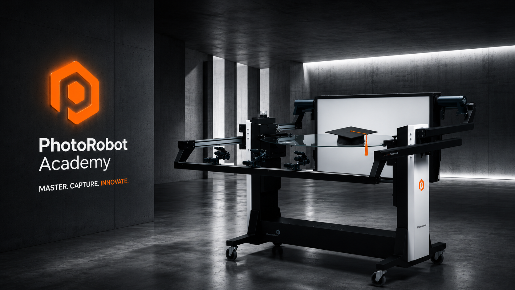 PhotoRobot turntable with graduation cap, illuminated PhotoRobot Academy logo and 'Master. Capture. Innovate.' slogan in a dark cinematic studio